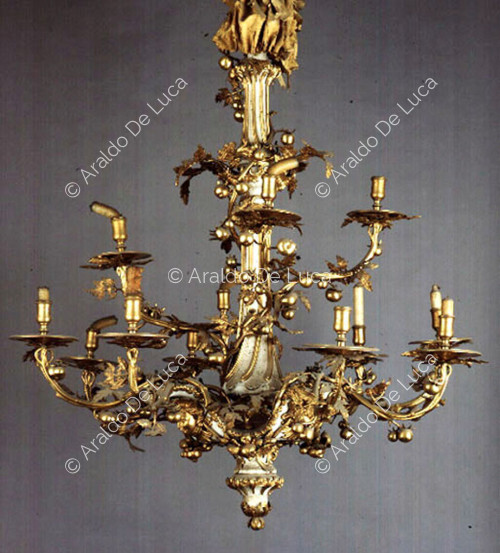Wood chandelier painted white and bronze