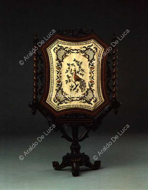 Mirror with wooden back decorated with embroidery