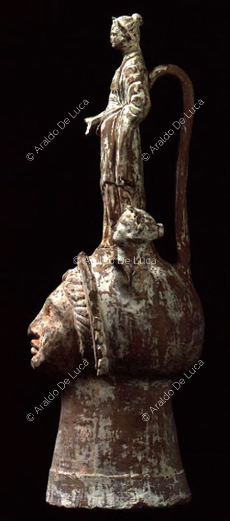 Vase configured as a female head