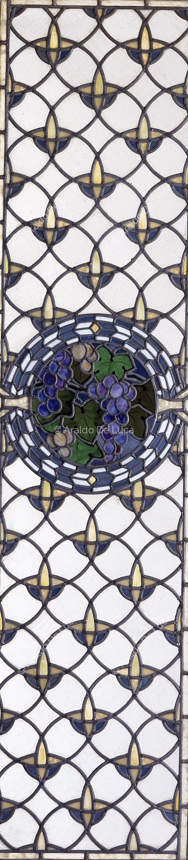 Stained glass with geometric motif and fruit