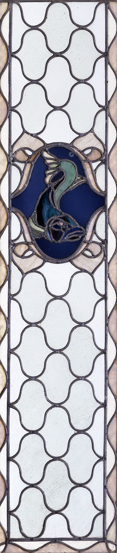 Stained glass with geometric motif and fish