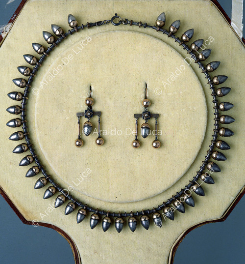 Necklace and pair of earrings
