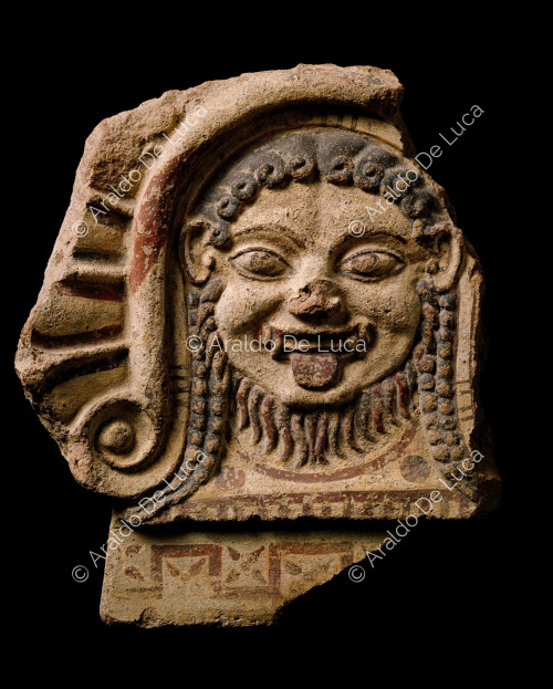 Polychrome terracotta antefix with mask