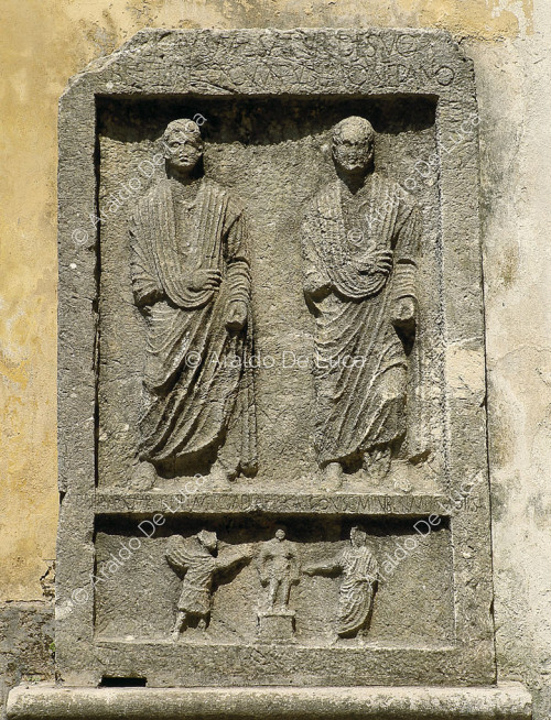 Tomb slab with togate figures