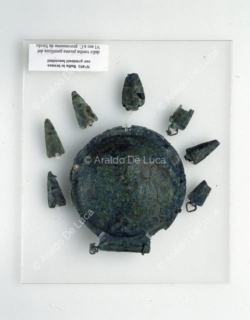 Bronze bulla with lance-shaped pendants