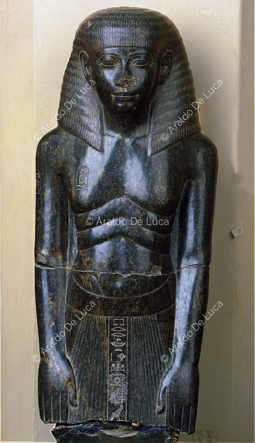 Perhaps Amenhotep, son of Hapu, standing