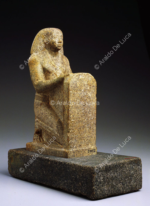 Statue with stele