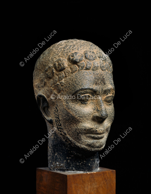 Head with floral decoration