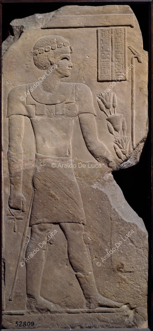 Relief with standing male figure
