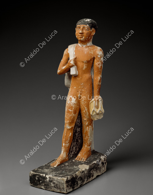 Figurine of a man wearing a sack and sandals