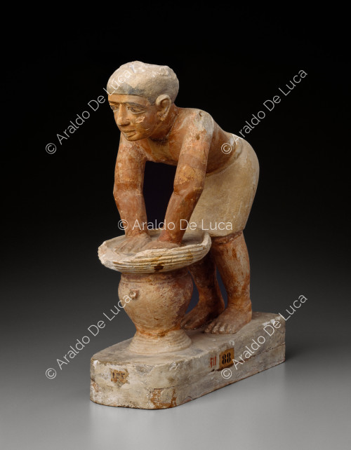 Statuette of a man brewing beer