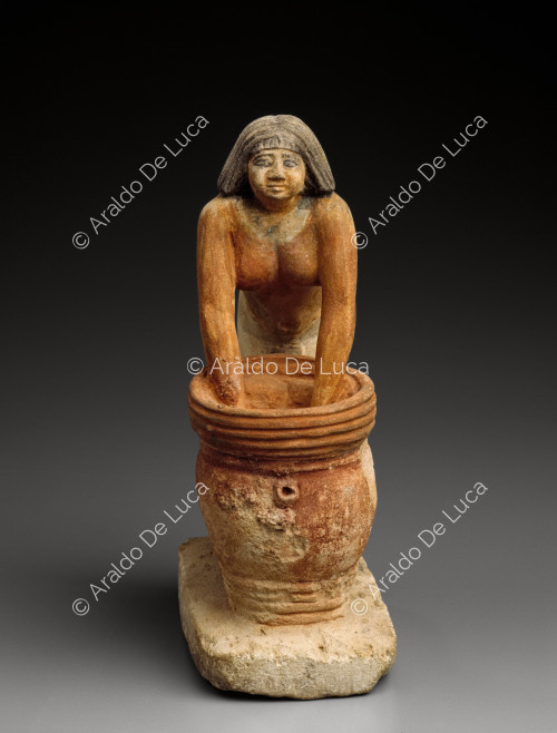 Statuette of a woman brewing beer