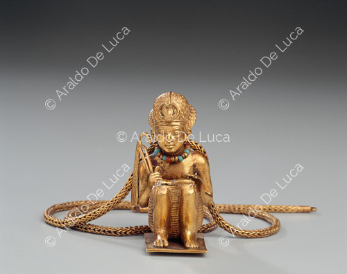 Tesoro di Tutankhamon. Statuetta d'oro raffigurante il sovrano accovacciato