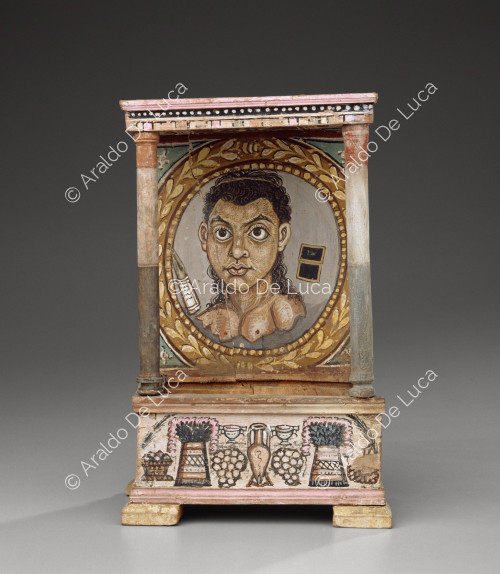 Wooden altar with female portrait