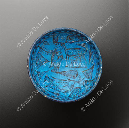 Faience cup with fish and floral decoration