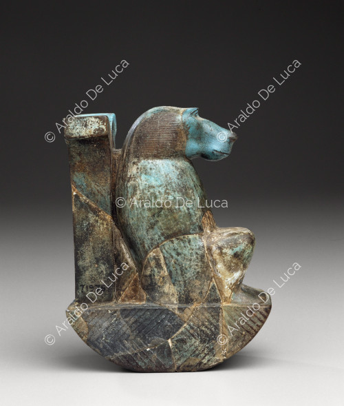 Faience figurine depicting a baboon above the Wdjat sign (side)