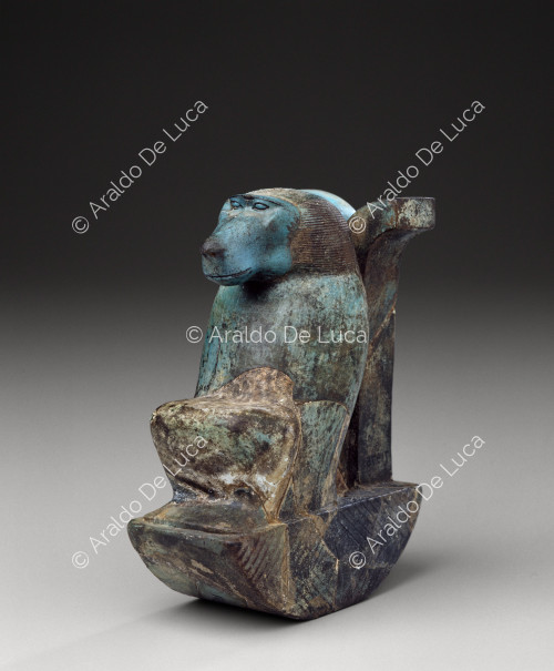 Faience figurine depicting a baboon above the sign Wdjat