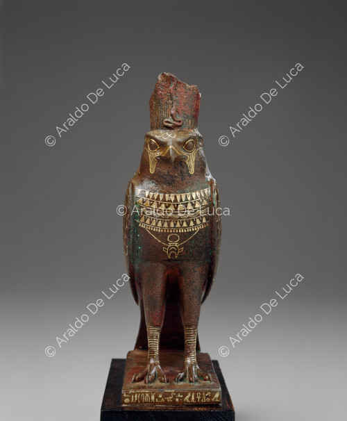 Statue of Horus with falcon likeness and heart-shaped amulet