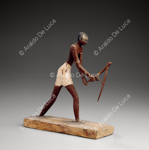 Statuette of a man hoeing