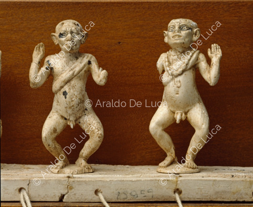 Figurines of three dancing dwarfs