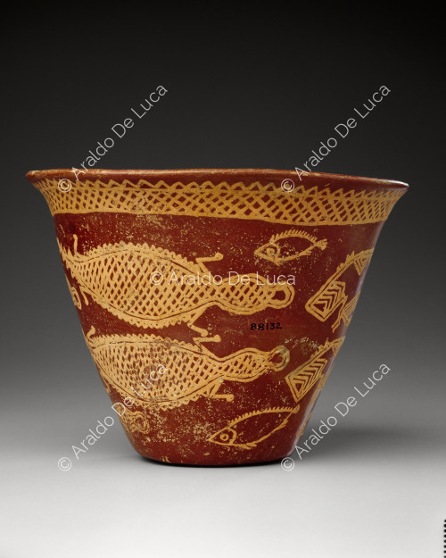 Vase decorated with fish and hippos