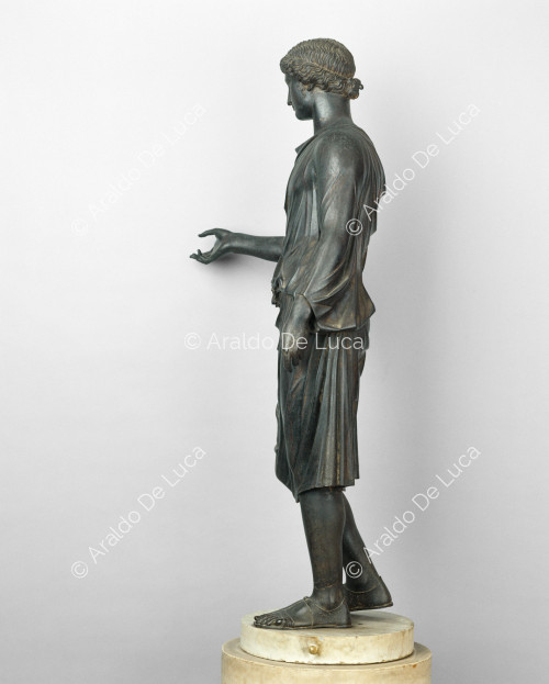 Female statue with raised arm
