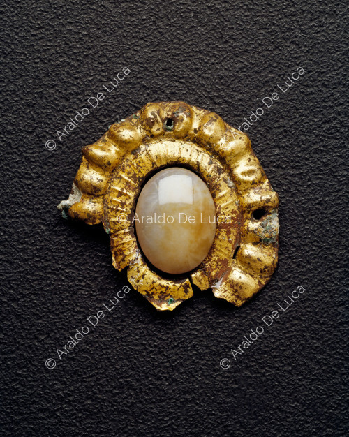 Exterior decoration of a bezel on an antique piece of furniture