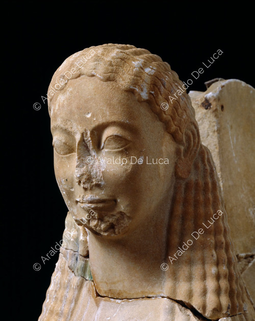 Archaic sphinx. Detail of the face