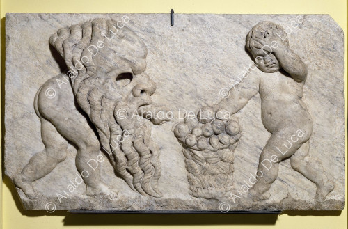 Modern relief with putti and Silenian mask