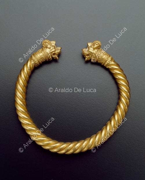 Gold bracelet with lion heads