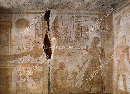 Ramesses offers incense and libations in front of the boat of his deified self. Detail