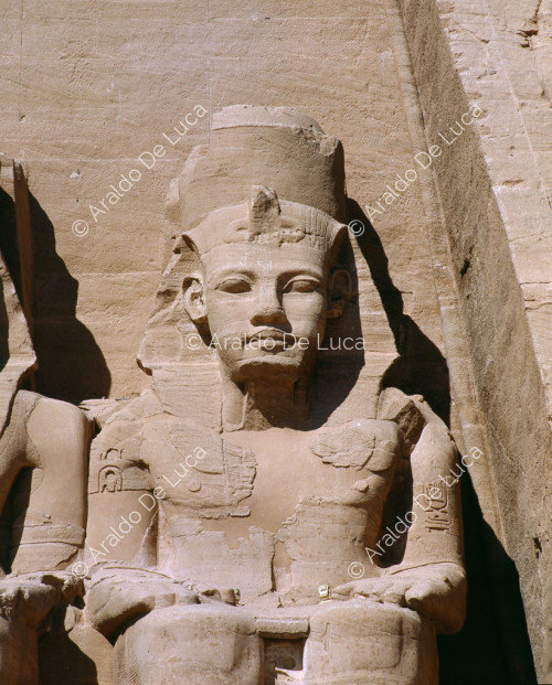 Facade of the Great Temple of Rameses II at Abu Simbel: detail of one of the colossi