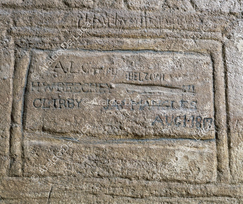 Wall decoration. Detail with inscription