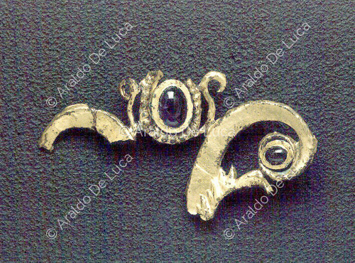 Gilded copper capital with gems