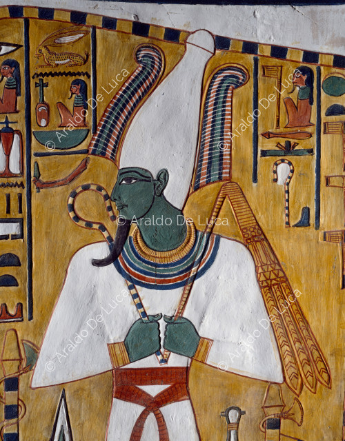 The god Osiris with the crown Atef and symbols of power