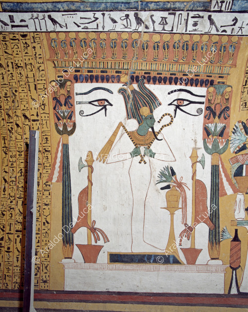 The god Osiris under a canopy.