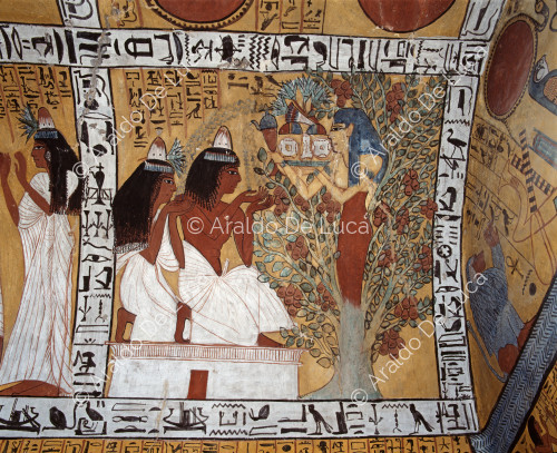 Sennedjem and his wife receive offerings from the sycamore goddess.