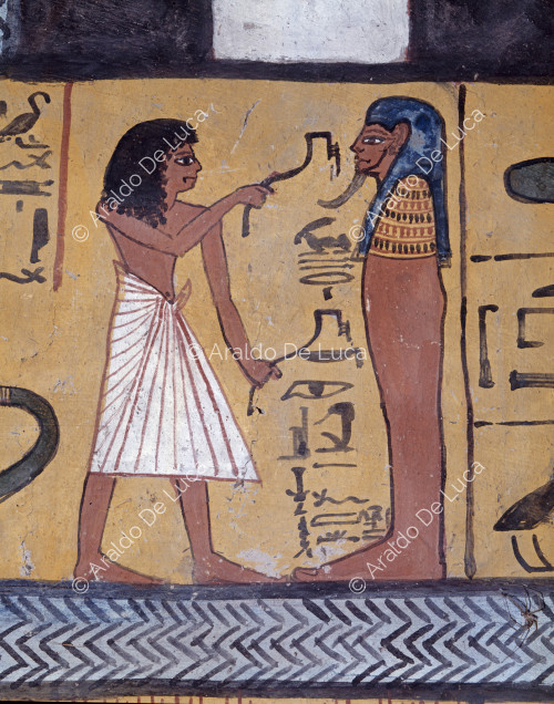 A son of Sennedjem practices the Opening of the Mouth on his father's mummy