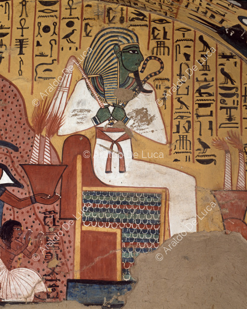 The god Osiris enthroned with the mountain of the West behind him.