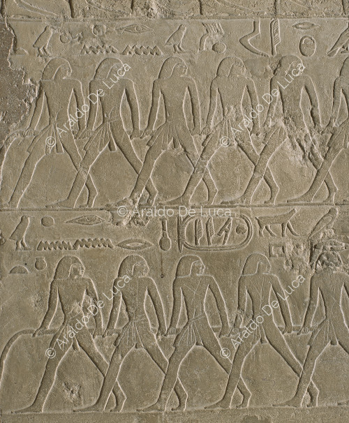 Relief with men and funerary boat from the mastaba of Qar