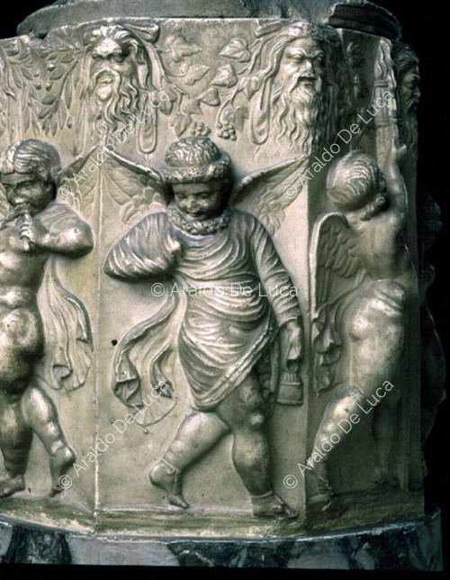 Cinerary urn decorated in relief. Detail