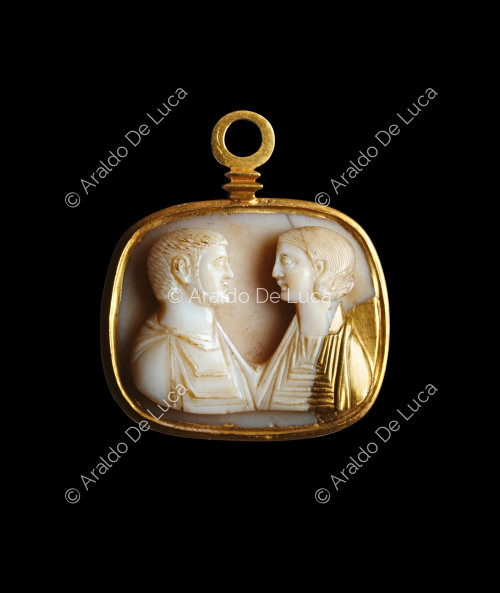Medallion with male and female bust facing each other