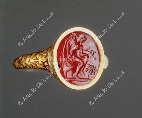 Ring with seated male figure