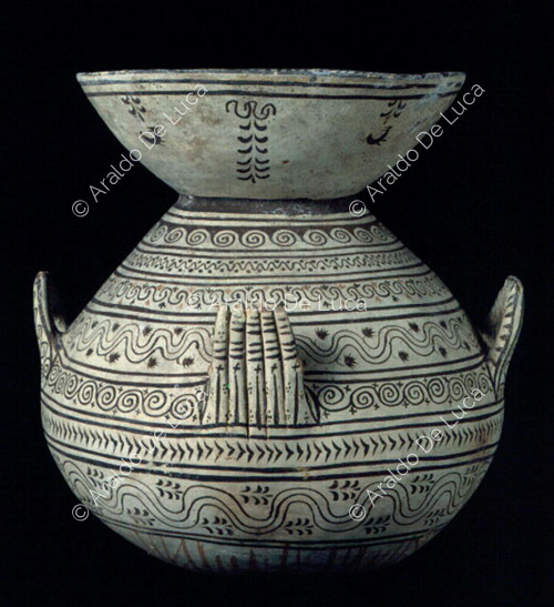 Olla decorated with geometric and plant motifs