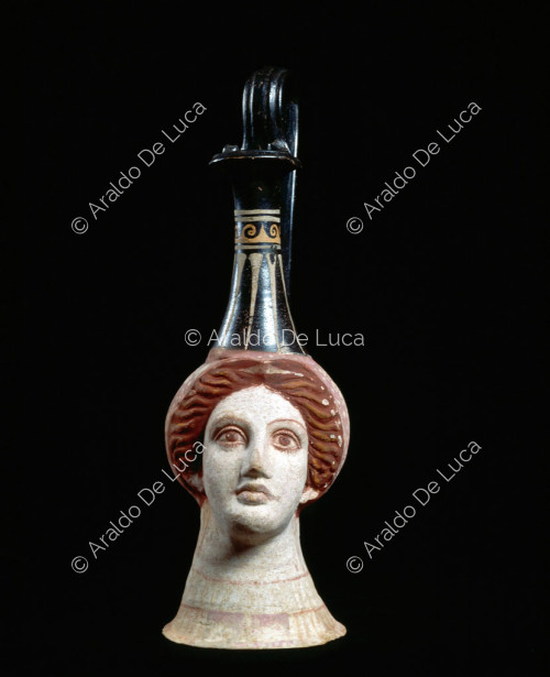 Polychrome vase in the shape of a female head