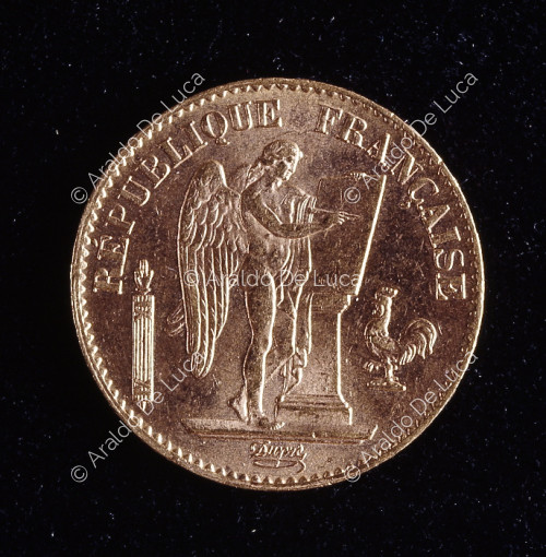 Genio alado de la República Francesa con viga y gallo,20 francos de oro de la tercera república francesa de la ceca de París