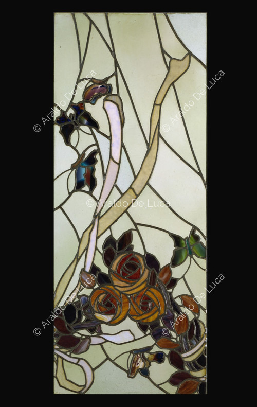 Stained glass window with flowers and butterflies