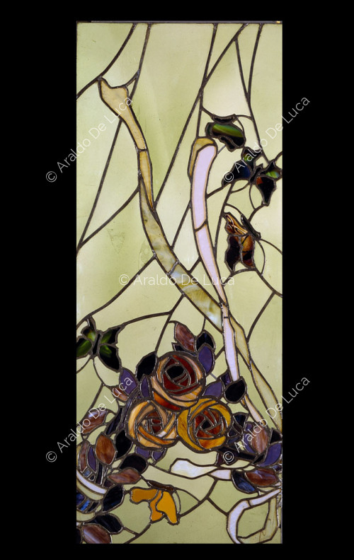Stained glass window with flowers and butterflies