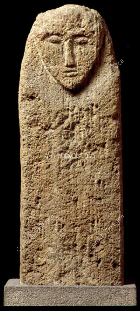 Votive stele with a human face