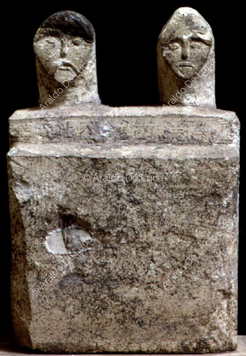 Votive stele with a human face